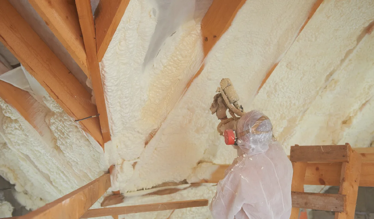 Commercial spray foam insulation service being performed in a Long Island building