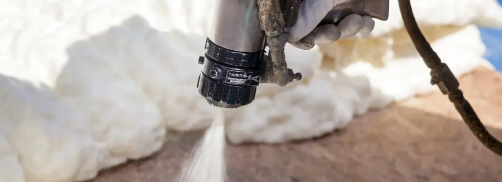 Close-up of spray foam insulation being applied in Long Island, NY.